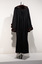 Photograph taken from the back of full length black ceremonial mayoral robe with dark fur trim on a silver mannequin.