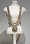 Photograph of a gold ceremonial Mayoral chain on a cream torso. The chain consist of small oval links, with a large drop medallion of the City of Brighton seal.