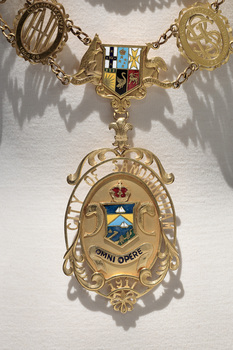 Photograph of the drop medallion detail of a gold ceremonial mayoral chain of the City of Sandringham