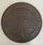 Round cast bronze plaque for City of Brighton crest, with a coastal scene in the centre and British Coat of Arms at the bottom.
