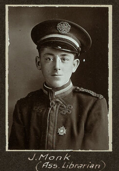 Black and white photograph of a young man in a uniform and cap with his name written underneath on the mount