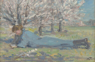 Figure reading in blue dress lying on grass in foreground under blossom trees.