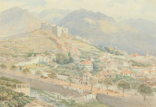 A walled city lays at the foot of the mountains, with a tall castle on the city's highest hill. There is a large waterway in the foreground with a river-wall. Small figures, animals and carts are walking along the edge of the city next to the river.