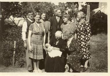 BLACK & WHITE  PHOTOGRAPH OF A FAMILY GROUP, INCLUDING LAURA HUDSON [AGE 93 YEARS] HOLDING HER GREAT-GRAND DAUGHTER, DEANNE C. TAYLOR [AGE 6 WEEKS]