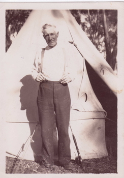 SNAPSHOT TEENA DAVIES STANDING OUTSIDE TENT