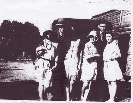 COPIES OF PHOTOGRAPHS:-GROUP OF SIX PEOPLE C1925 AND CHILD IN A PRAM, C1941, GRAND-CHILDREN OF EDWIN RYAN, A POLICE INSPECTOR.