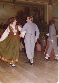 DANCE AT THE CLUNES TOWN HALL. TWO COUPLES IN TRADITIONAL EUROPEAN COSTUMES