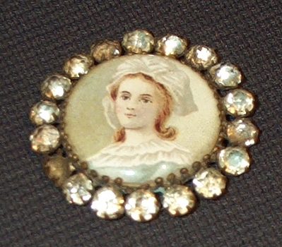 Costume or paste jewelry brooch typically worn in the past