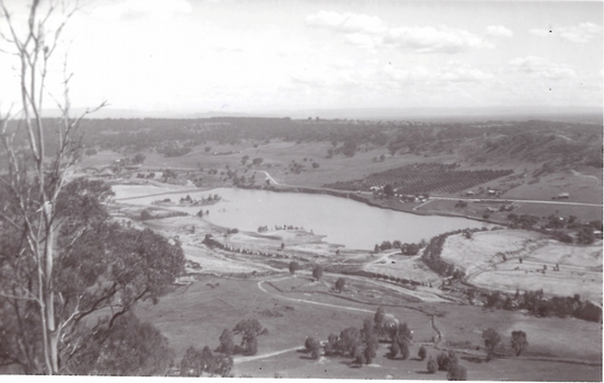 Large pond surrounded by paddocks.