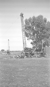 Steam driven tall mining drill.