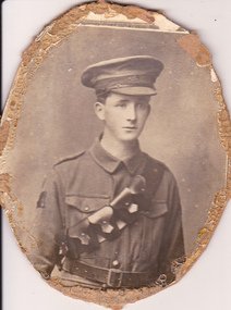 Studio portrait of solder in Australian Infantry Forces uniform.