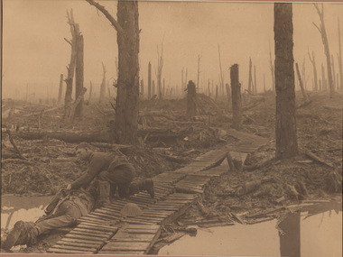 Photograph, Frank HURLEY, An Australian rescuing a fallen comrade in the Ypres Sector, Belgium, October 29, 1917, 1917