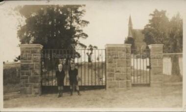 Photograph (Item), 2 Boys Outside Gates Of Malmsbury St Johns Church Of England, Malmsbury c1930