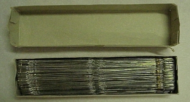 Heddle, White cardboard box containing approximately 144 heddles (heddle wires)