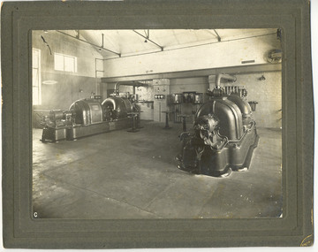 Photograph, [Electricity generators in boilerhouse]