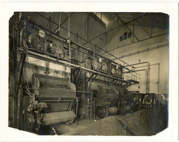 Photograph, [Hoppers feeding coal into boiler]