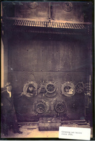 Photograph, Cleaning out boiler circa 1920