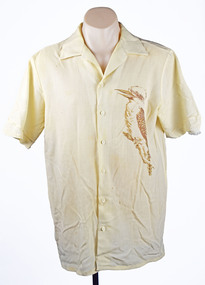 front view of a cream coloured shirt with a printed brown kookaburra on the right hand side
