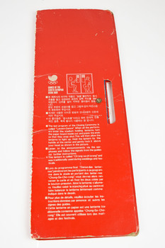 a red card with written text in multiple languages 