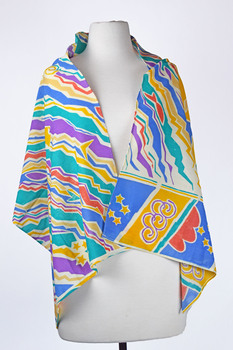 front view of a vibrant coloured scarf draped over a mannequin, colours include turquoise, purple, yellow, blue and orange.