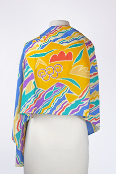 rear view of a vibrant coloured scarf draped over a mannequin, colours include turquoise, purple, yellow, blue and orange.