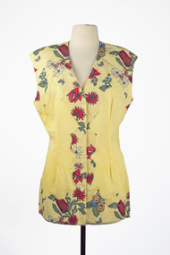 front view of yellow sleeveless shirt with native botanical pattern