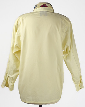 back view of long sleeve cream shirt with floral printed neck tie