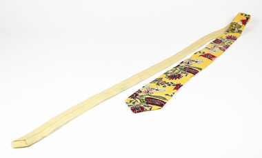 tie showing cream back and yellow front with native botanical design