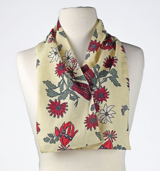 cream scarf with native botanical print draped around mannequin 
