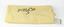 folded cream fabric with paper tag and number written in black ink on fabric