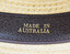 detail of gold inscription on black leather