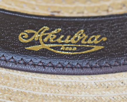 detail showing gold inscription on black leather