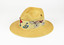 straw hat with floral textile band and pin