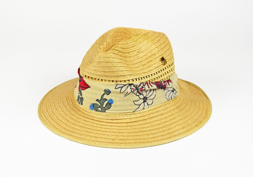 straw hat with floral textile band and pin
