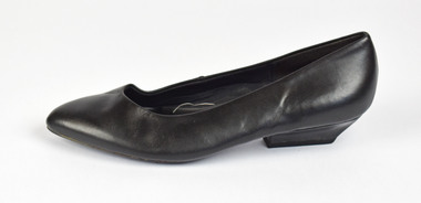 side view of a black heeled leather shoe