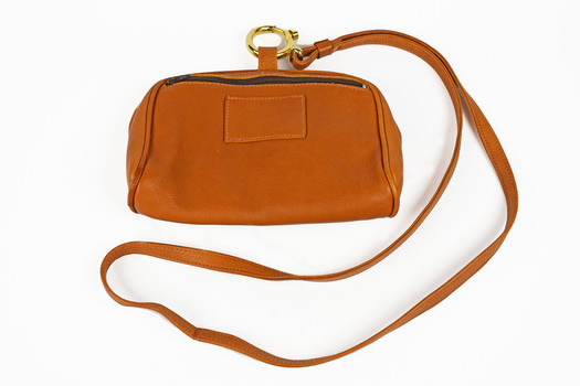 back view of brown leather bag with strap