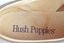 detail showing inscription on inner sole of shoe in brown lettering which says hush puppies