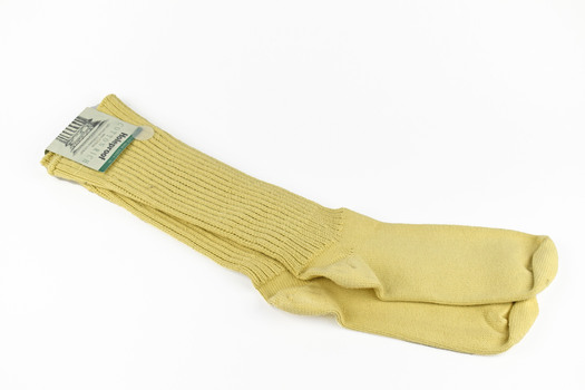 pair of cream socks with paper tag