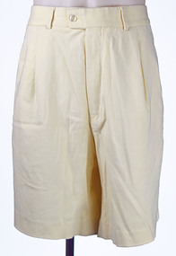 front view of cream shorts with zip and button waist on mannequin