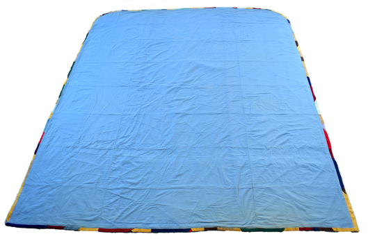 back of quilt showing blue backing fabric