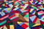 front of multi-coloured quilt with geometric pattern