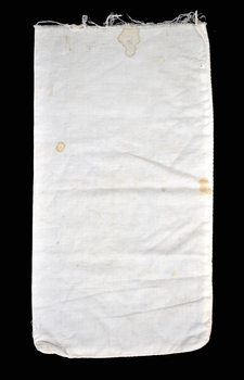 reverse side of calico bag with brown stains