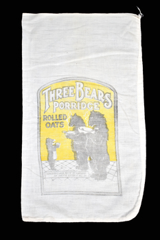 white and black graphic on calico bag showing three bears holding bowls