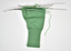 A green knitting glove in progress with knitting needles still attached