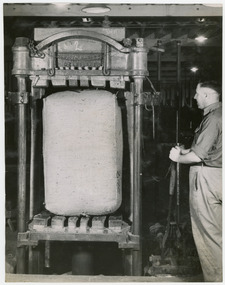 Photograph - Bale in Dumping Machine, 1960s