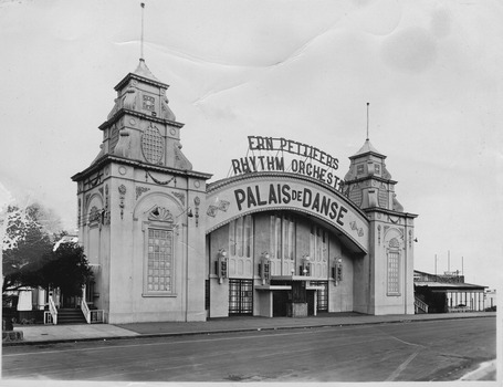 Front of building showing main entrance. Above the entrance is a sign advertising Ern Pettifer's Rhythm Orchestra.