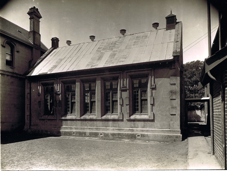 Single storey brick building with corrugated iron roof