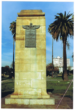 Plaque on tall stone pillar in a park