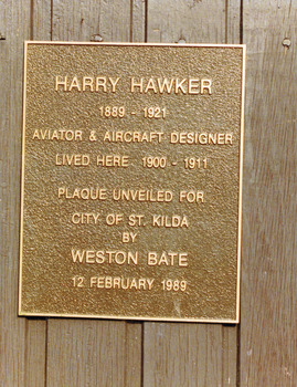 Rectangular metal plate inscribed with the following words: Harry Hawker 1889-1921 Aviator & Aircraft Designer lived here 1900-1911. Plaque unveiled for City of St Kilda by Weston Bate 12 February 1989