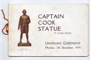 A bronze statue of Captain Cook and the title of the booklet.